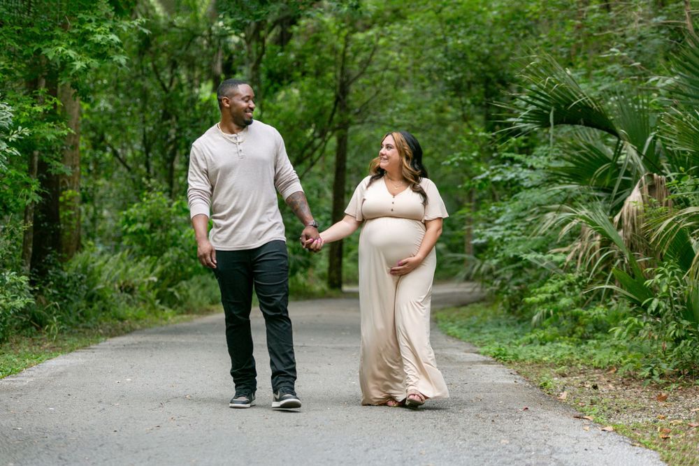 Orlando Maternity Photography, Sanford Maternity Photography, pregnant mom and dad holding hands in the park