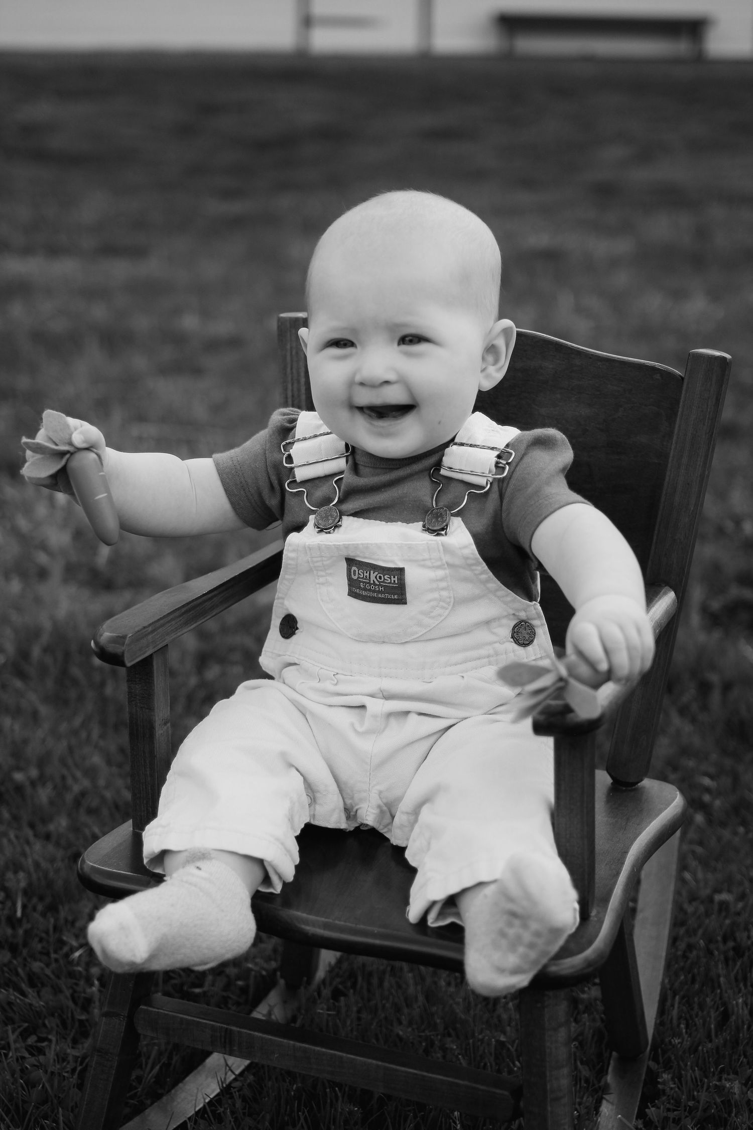 a sitting, laughing baby