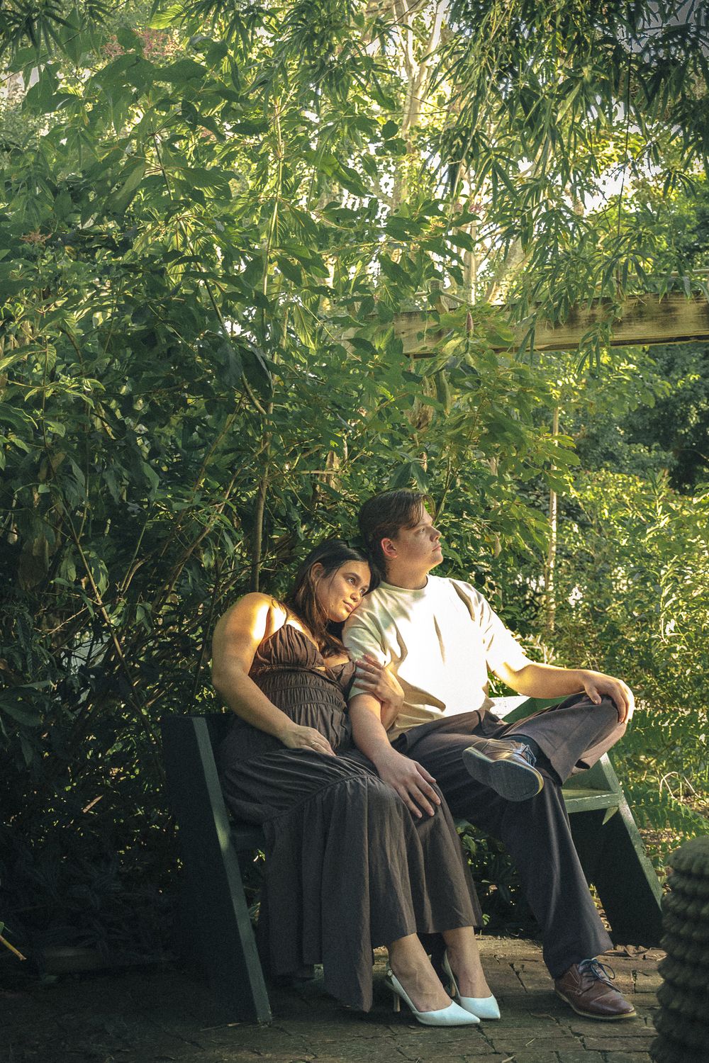 a couple sitting together on a bench