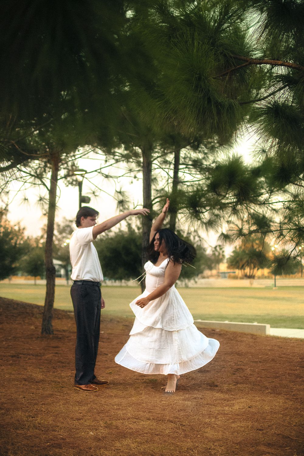 a couple dancing together in a field