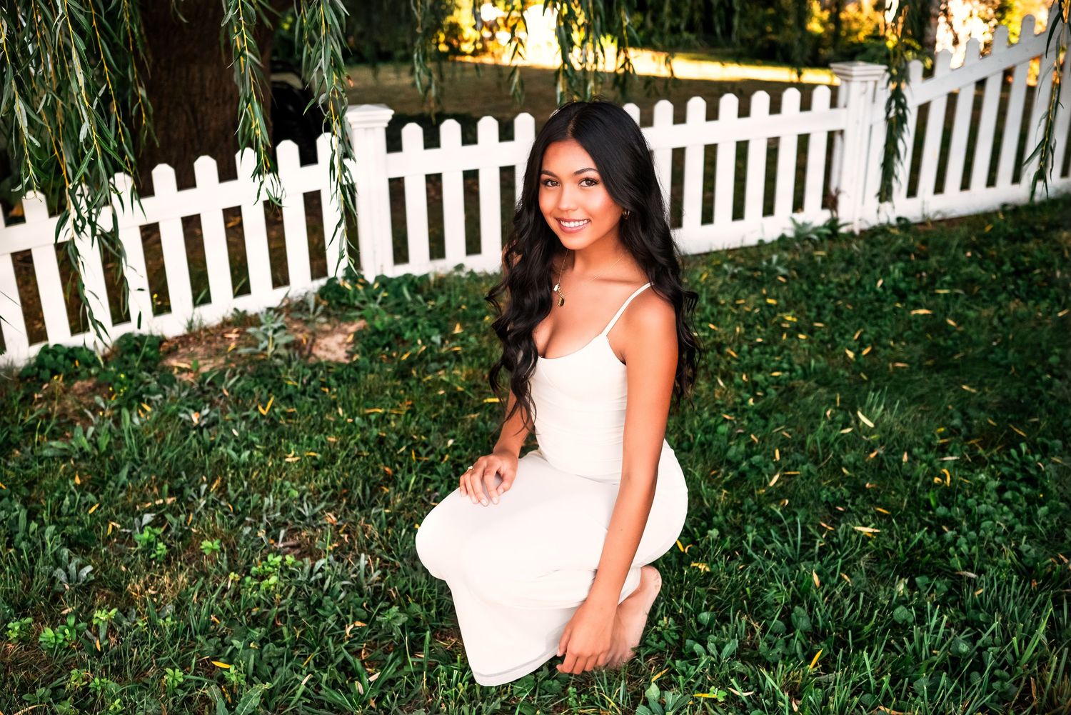 A series of outdoor photos in a garden setting with a white picket fence and lush greenery in the background.
