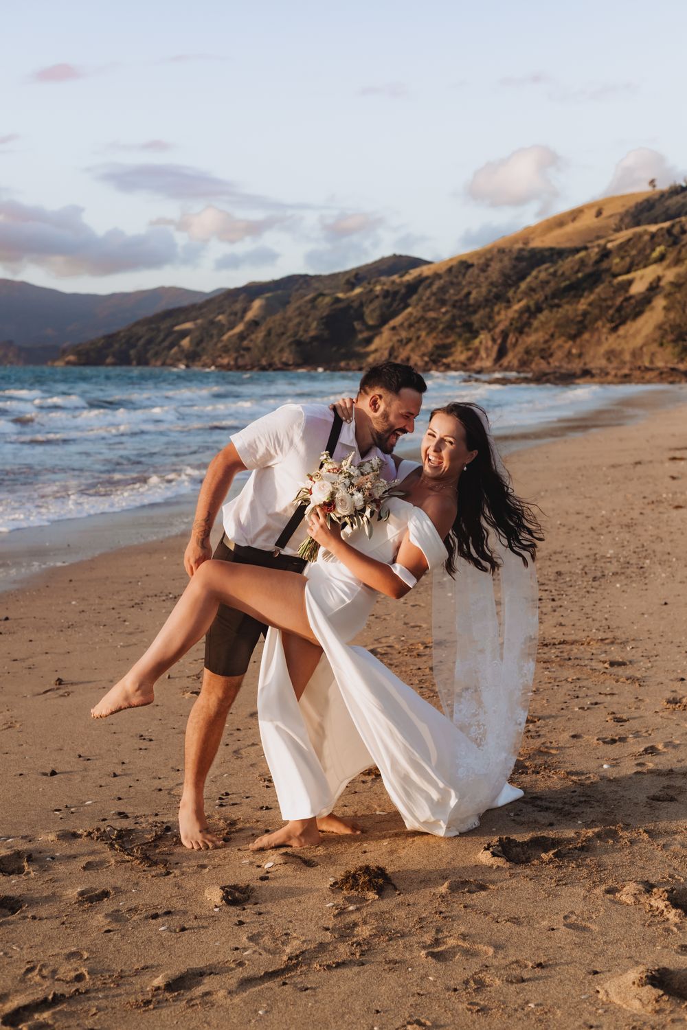 Jasmin and Eric Elopement bridal photo at Waitete Beach by photographer Jenna James Photography