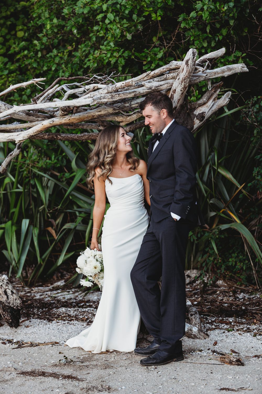 Laura and Mitchell at Wyuna bay beach at their coromandel wedding