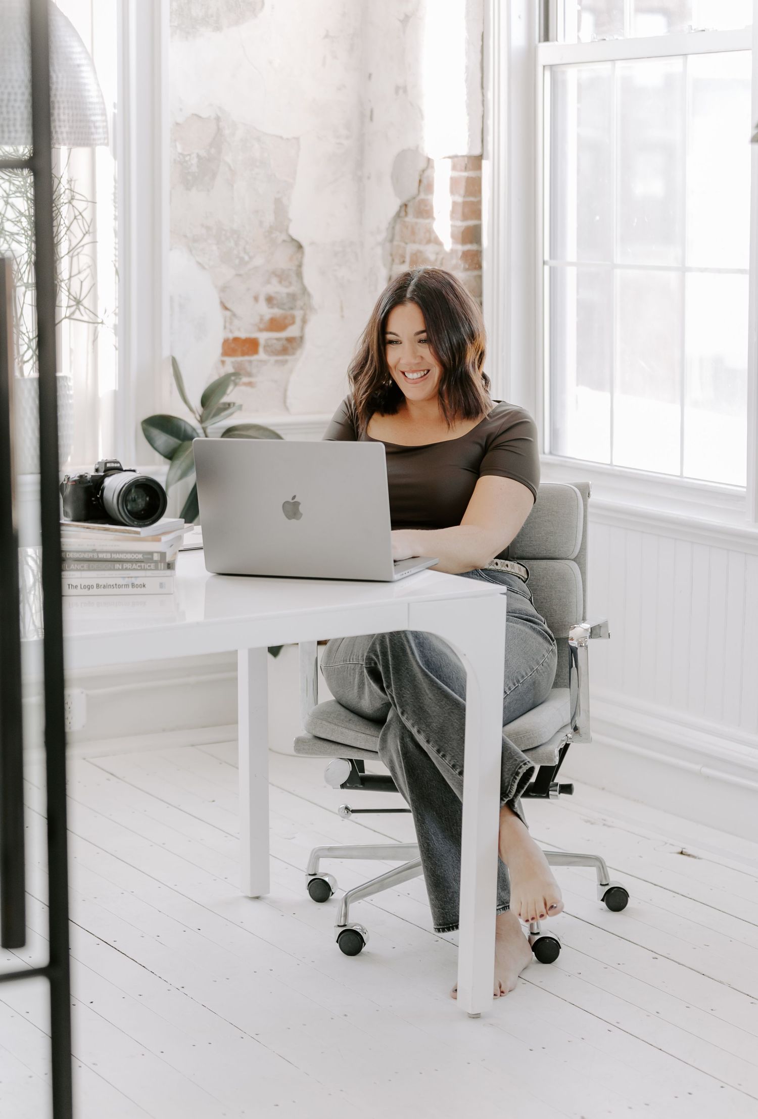 Series of lifestyle photos showing a woman working on laptop in bright white modern office space.