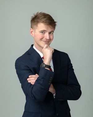 Series of professional studio portraits showing expressive poses in a navy suit against light background.