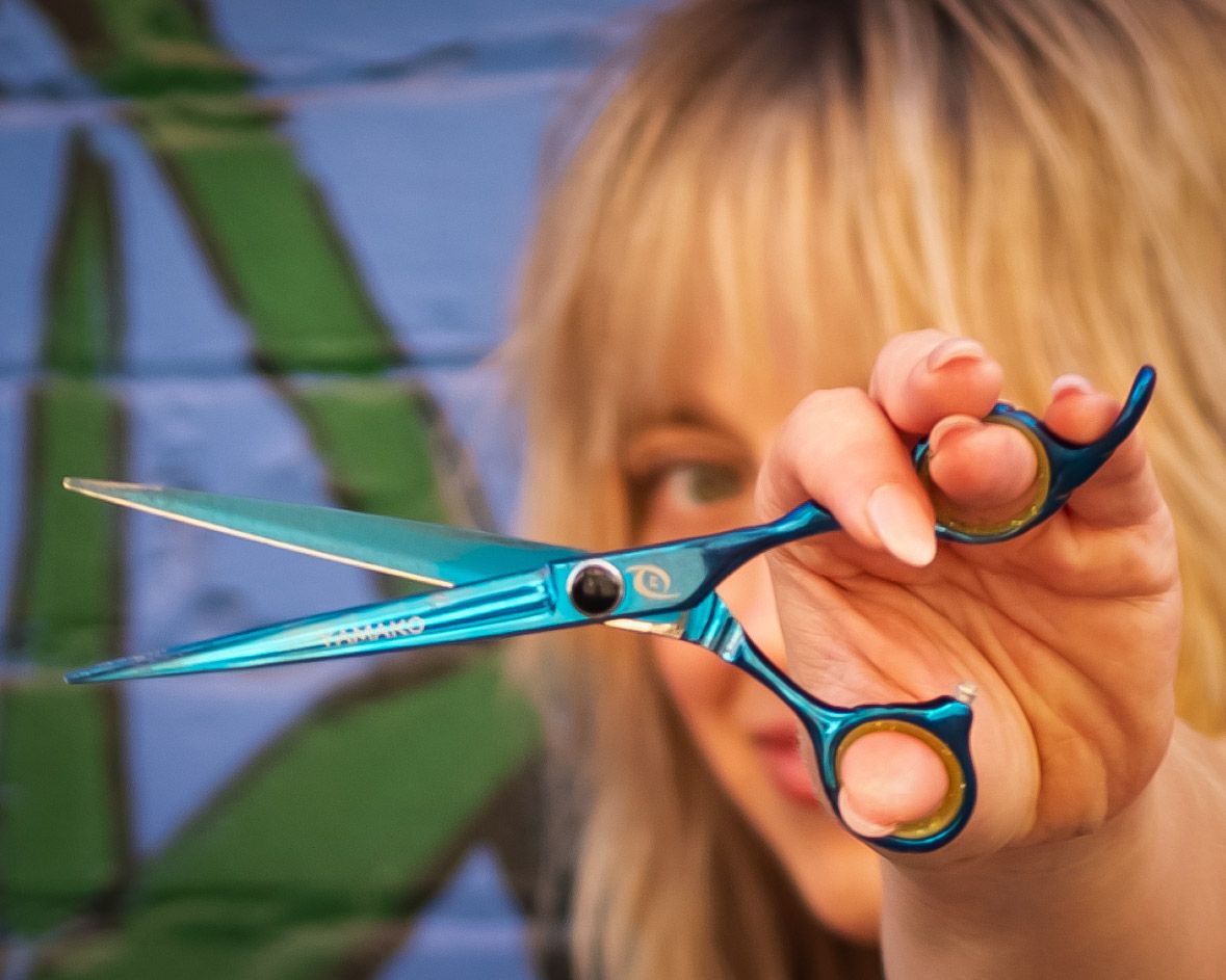 A series of photos showing scissors with blue handles being held against a blurred green background.
