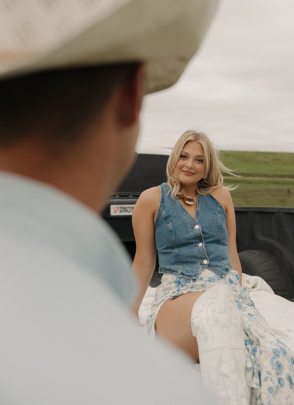 A series of candid photos showing someone in a denim top and white flowing dress posing in a natural outdoor setting.