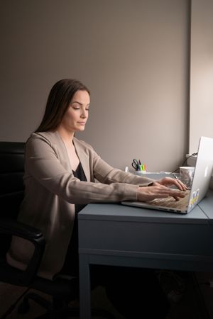 Quiet branding photography, natural light working at a desk.