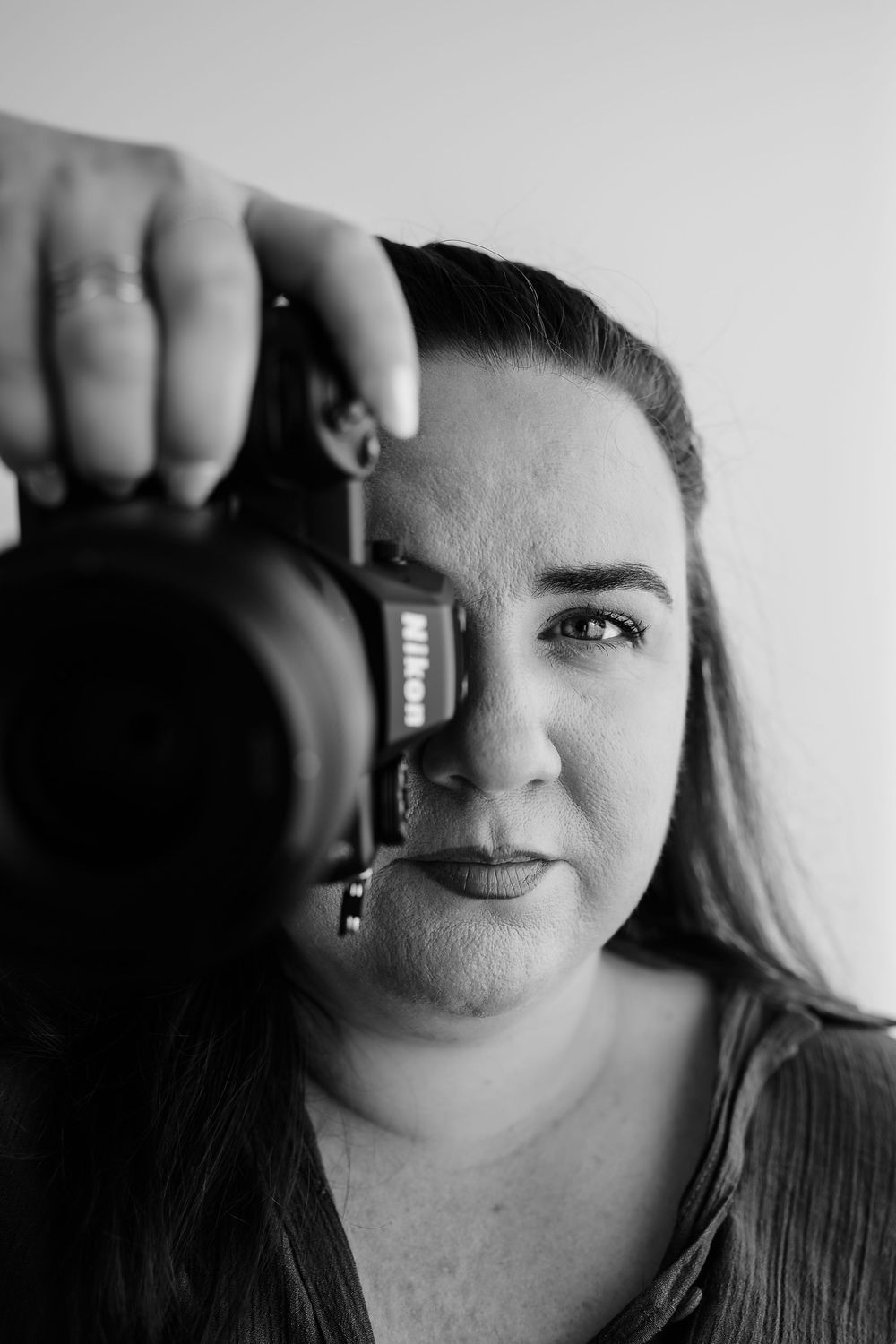 Black and white self-portrait series showing gladstone photographer with camera.