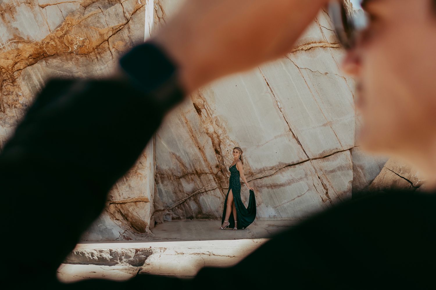 A stylish matric farewell photoshoot capturing a young couple dressed in elegant formal attire, posing with a scenic backdrop