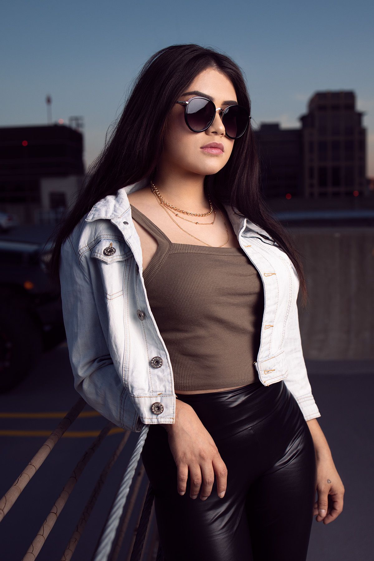 High school senior girl posing in front of a graffiti wall in Minneapolis photographer Gerardo Dominguez