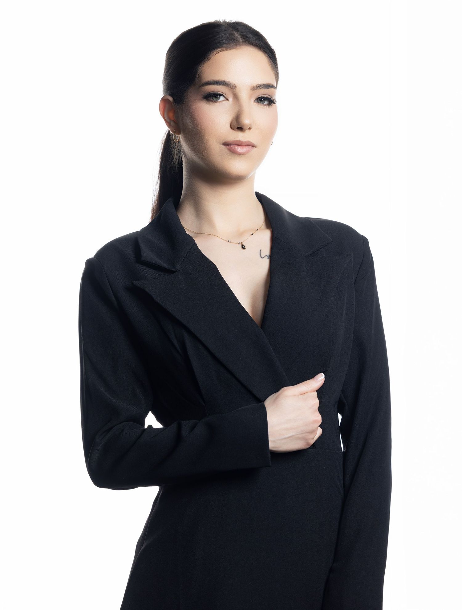 Professional studio portrait of a person wearing an elegant black blazer. Minneapolis Photographer Gerardo Dominguez.