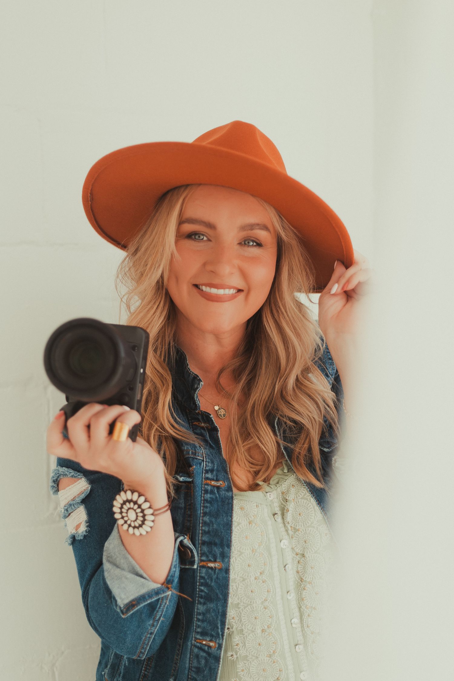 blonde photographer orange hat