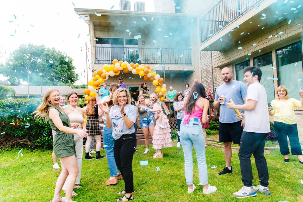 Group celebration photos taken outdoors with confetti and natural scenery.