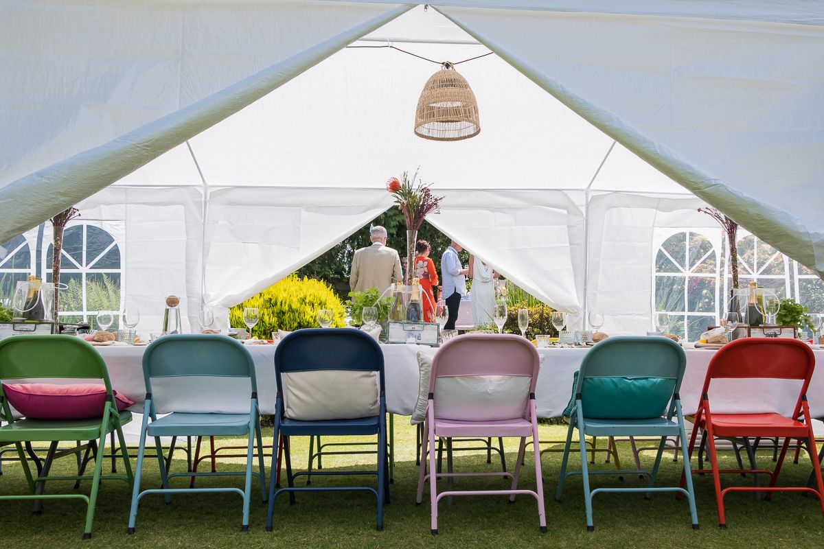 Inside a garden marquee looking into the garden