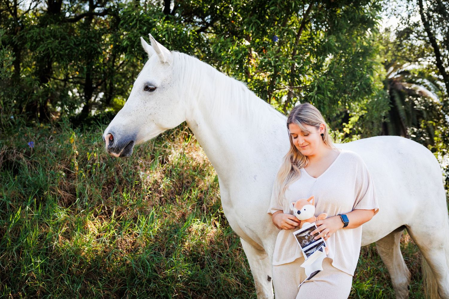 Maternity photo session with a white horse, outdoors at São Miguel island, Azores.