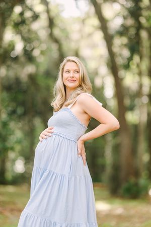 pregnant mama looking gorgeous in a park during maternity photoshoot in st Augustine, fl