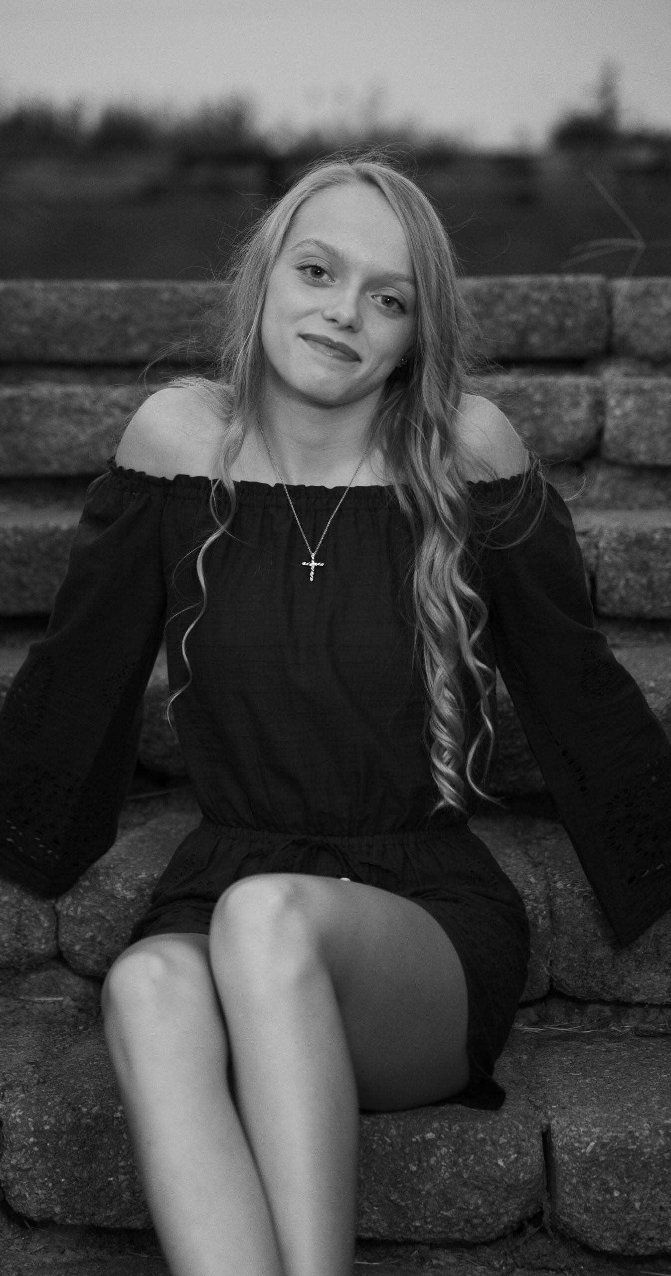 Black and White portrait photo of a young woman sitting