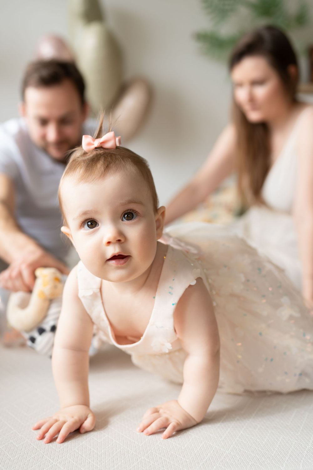 A cute little baby girl crawling and smiling