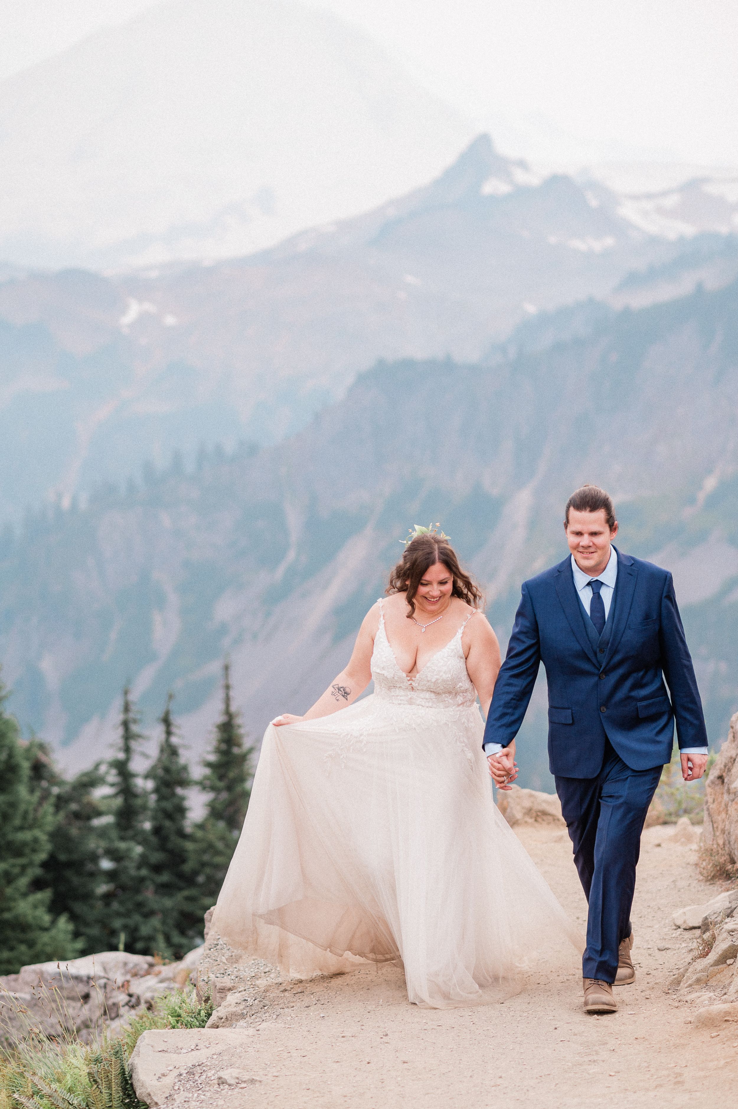 bride and groom walking hand in hand during Mt. Baker elopement