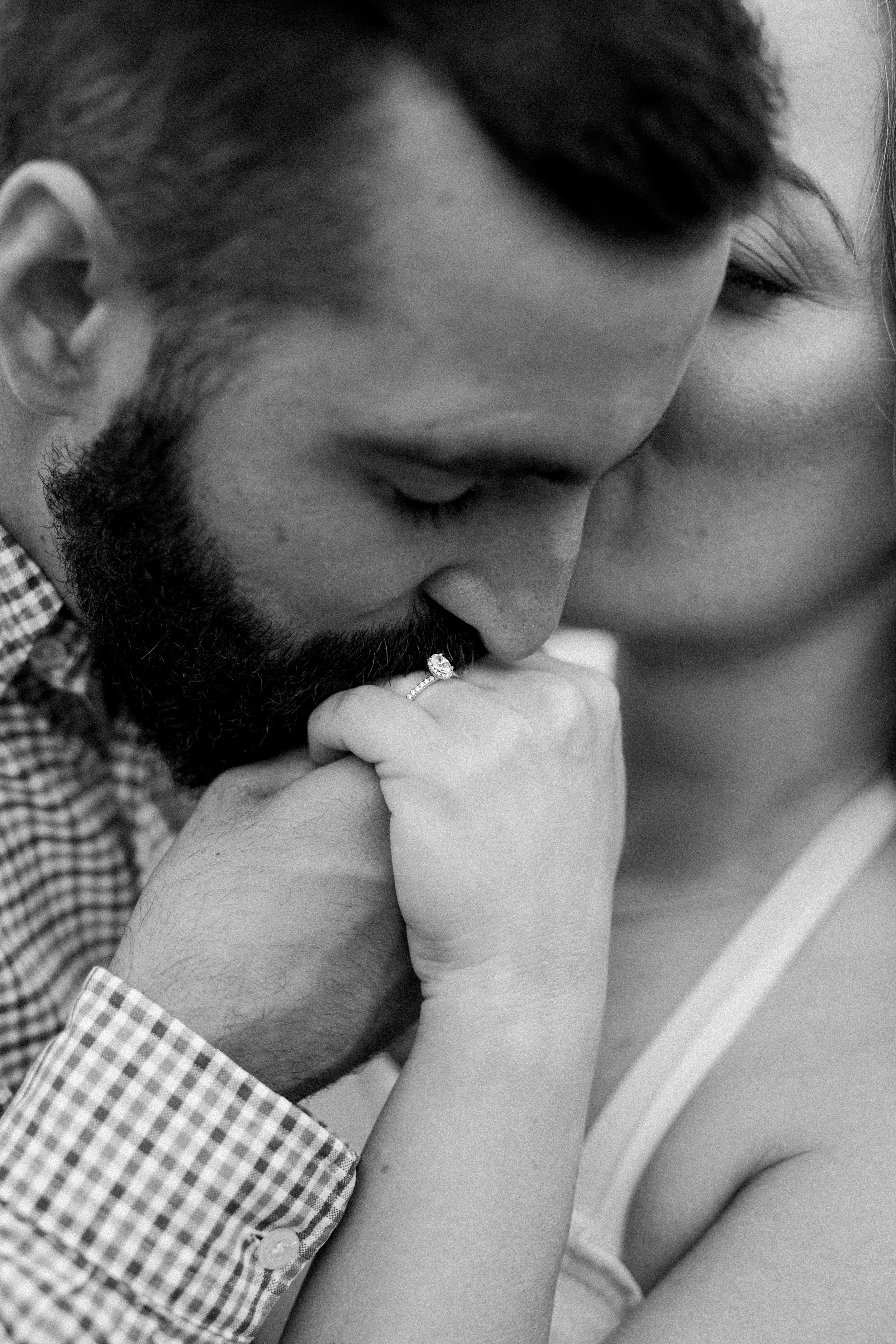 Intimate black and white close-up of tender moment.