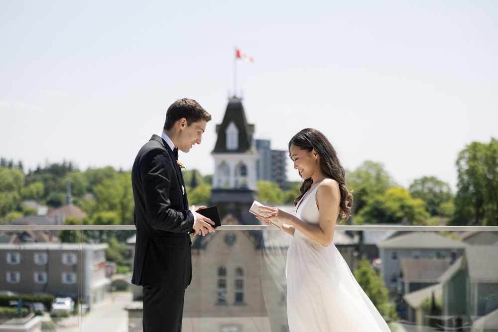 couple wedding photography at rooftop terrace of The Postmark Hotel, Newmarket. Vow exchange of bride and groom.