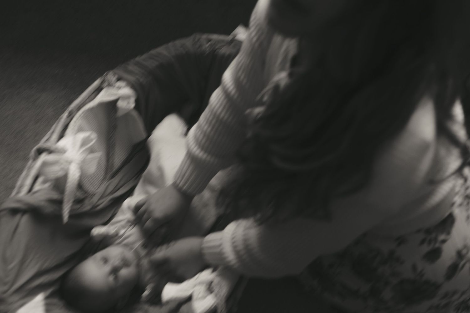 family photographer captures an artistic shot of a mother holding her baby in morris county nj