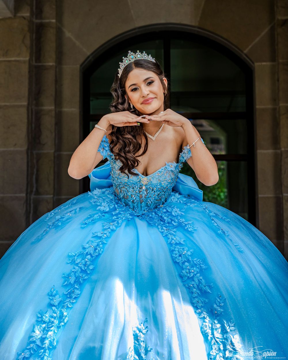 Stunning turquoise quinceañera dress with beaded details and full ballgown silhouette.