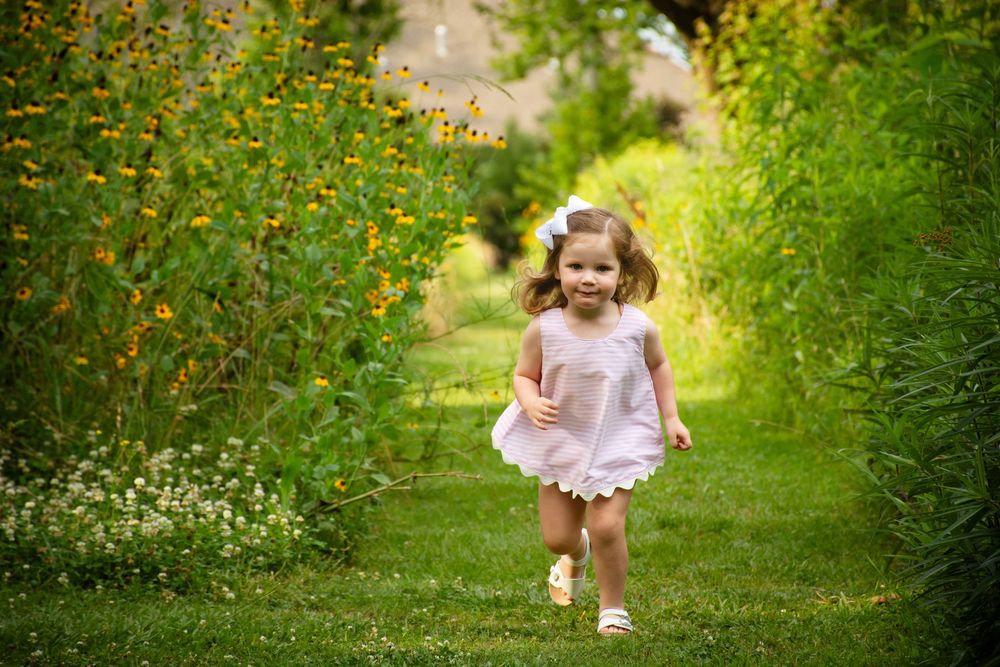 Little girl running in a field