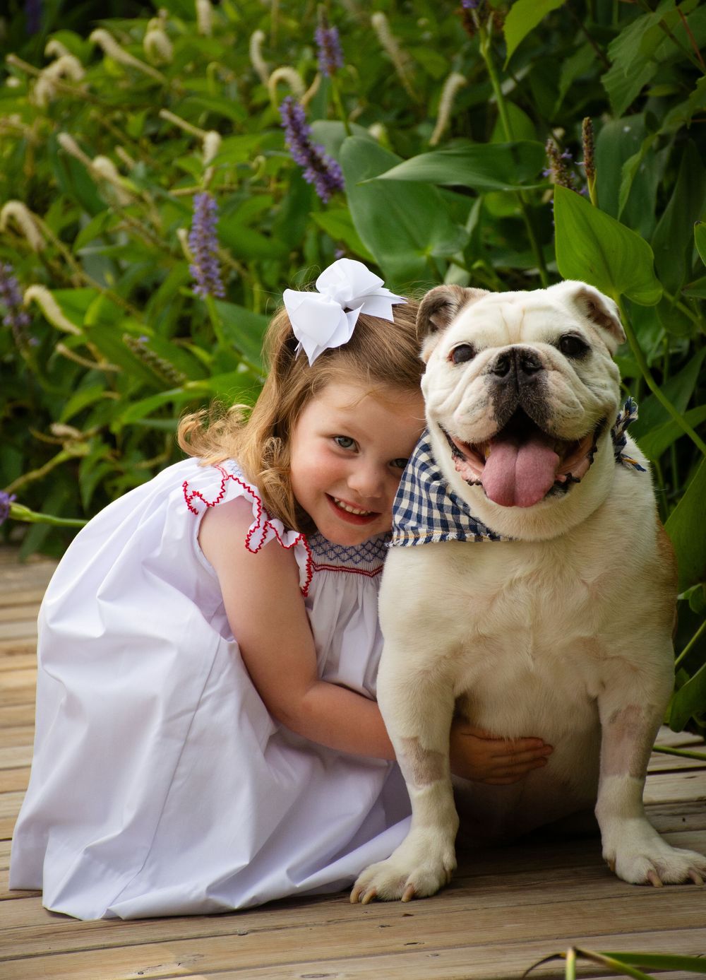 Little girl hugging a dog