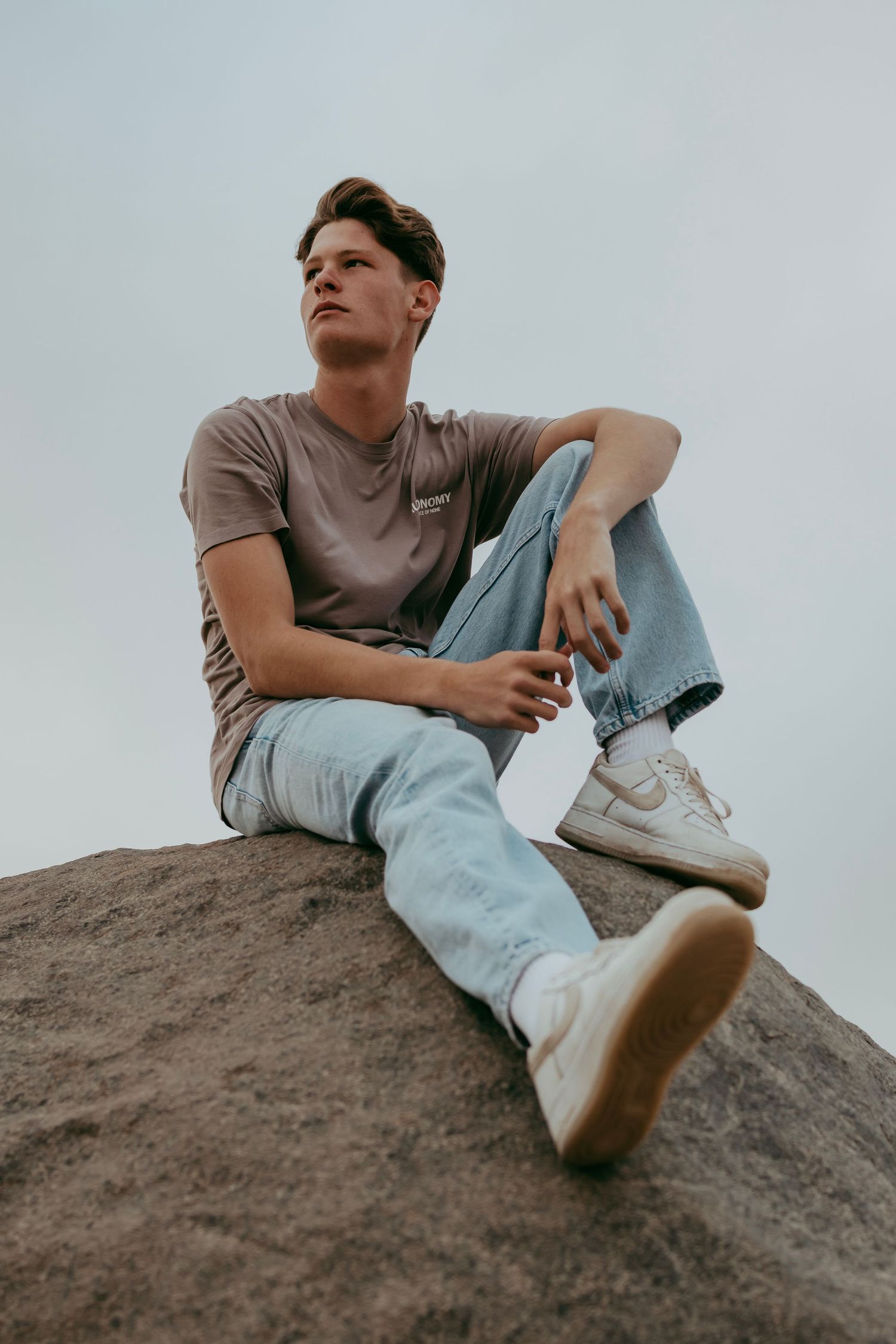 A handsome young man posing for a photoshoot in the Namib Desert,