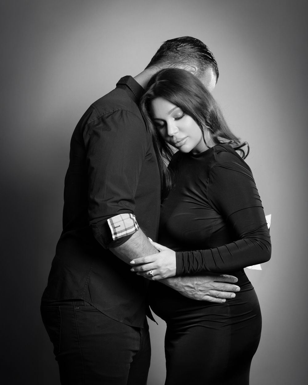 Two figures embracing in artistic black and white silhouette series capturing intimate emotional support moments.