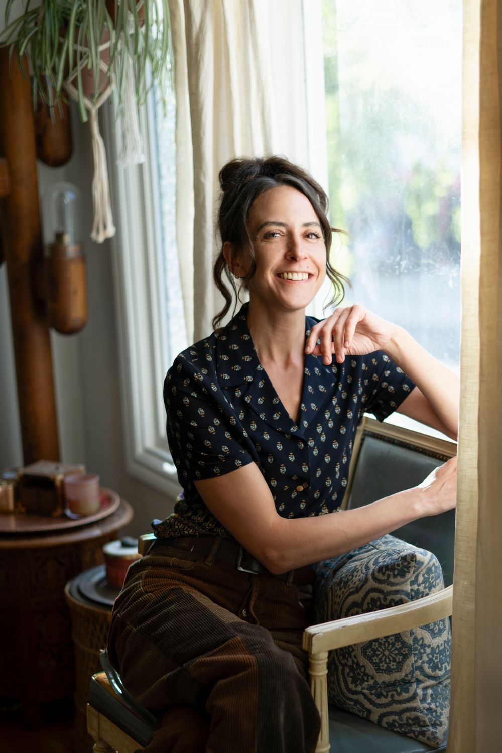 San Francisco Bay Area wedding, portrait and elopement photographer sits in her home in Berkeley, CA