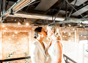Warm-toned indoor photography in an industrial space with exposed brick and beams.