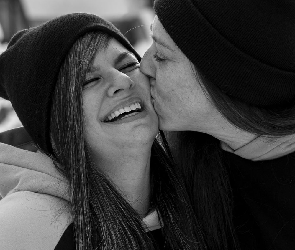 A couple kissing.