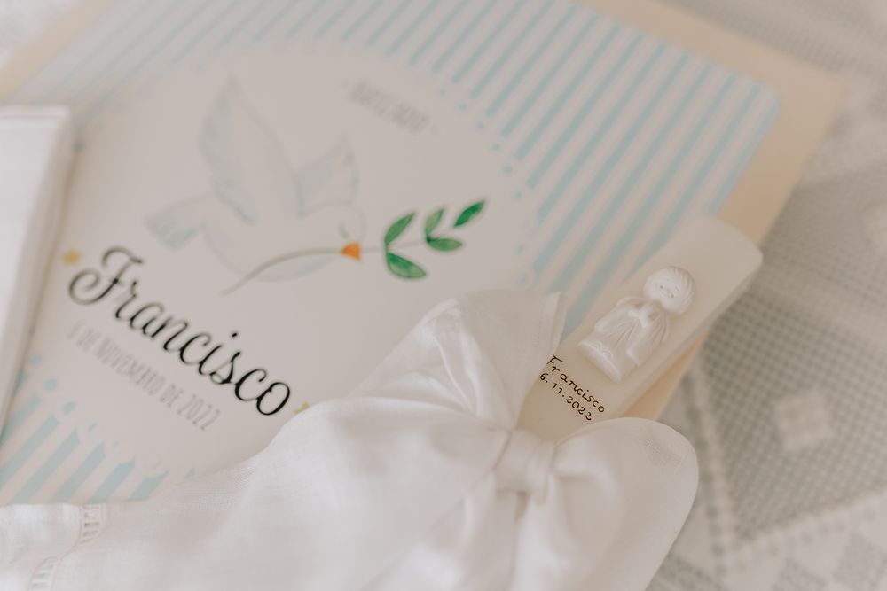 Elegant baptism fan and keepsakes for Francisco, featuring a white dove and green leaves on pastel blue striped paper.