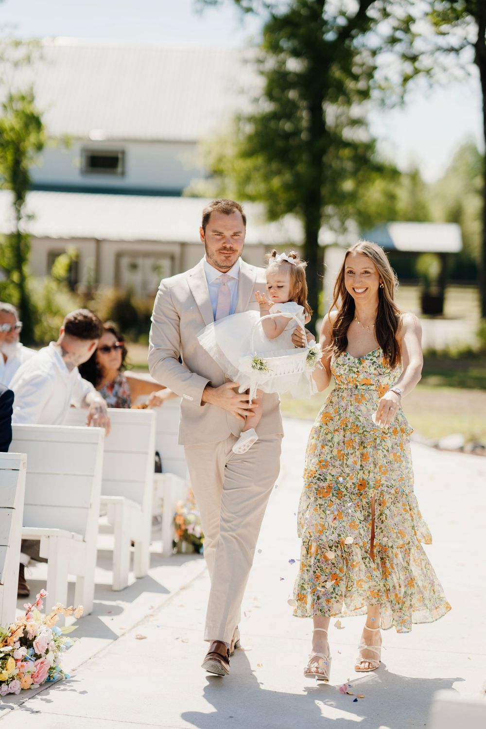 Romantic wedding photo at The English Country Barn of the Carolinas featuring a couple in soft spring light. Photo and Video team.