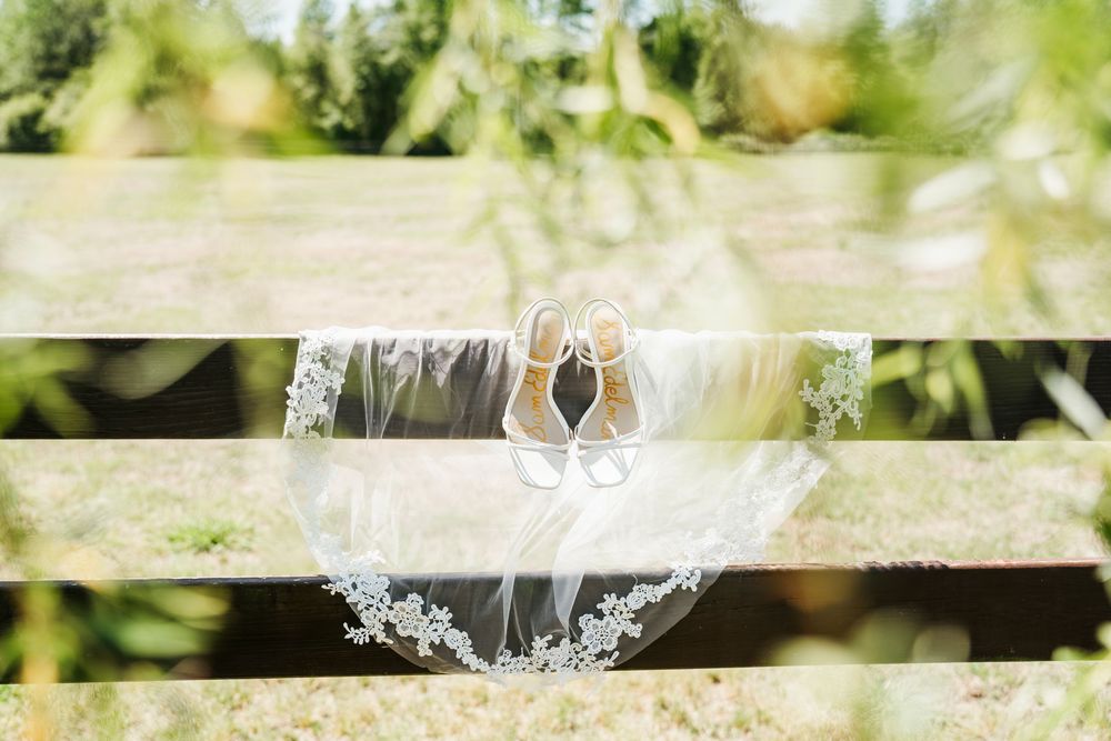 Romantic wedding photo at The English Country Barn of the Carolinas featuring a couple in soft spring light. Photo and Video team.