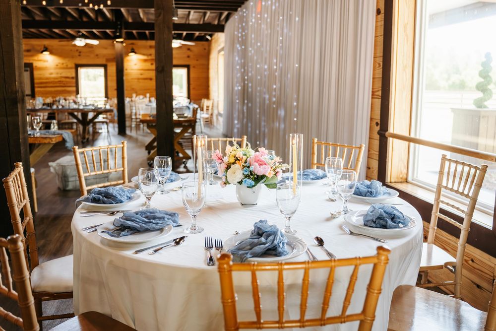 Romantic wedding photo at The English Country Barn of the Carolinas featuring a couple in soft spring light. Photo and Video team.