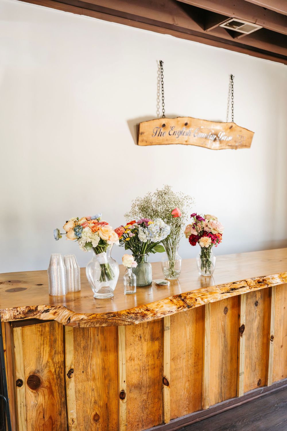 Romantic wedding photo at The English Country Barn of the Carolinas featuring a couple in soft spring light. Photo and Video team.