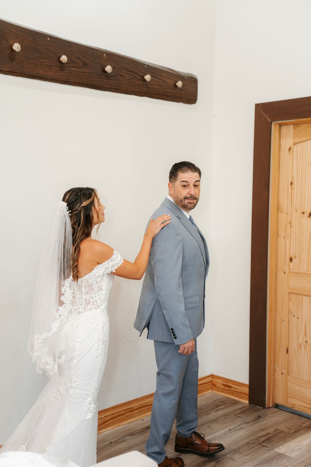 Romantic wedding photo at The English Country Barn of the Carolinas featuring a couple in soft spring light. Photo and Video team.