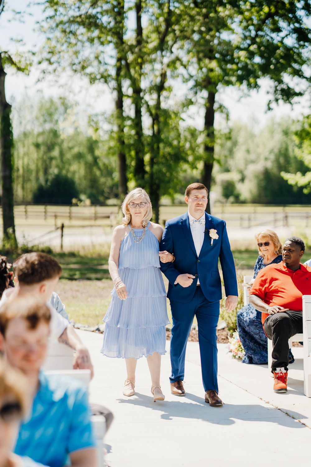 Romantic wedding photo at The English Country Barn of the Carolinas featuring a couple in soft spring light. Photo and Video team.