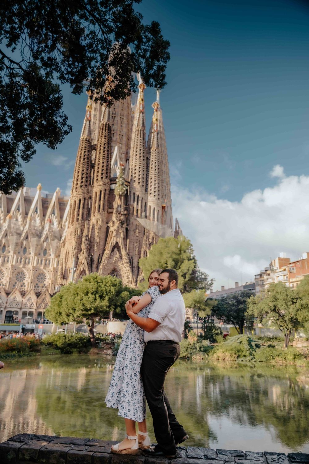 Couple walking away from camera hand in hand in Barcelona.