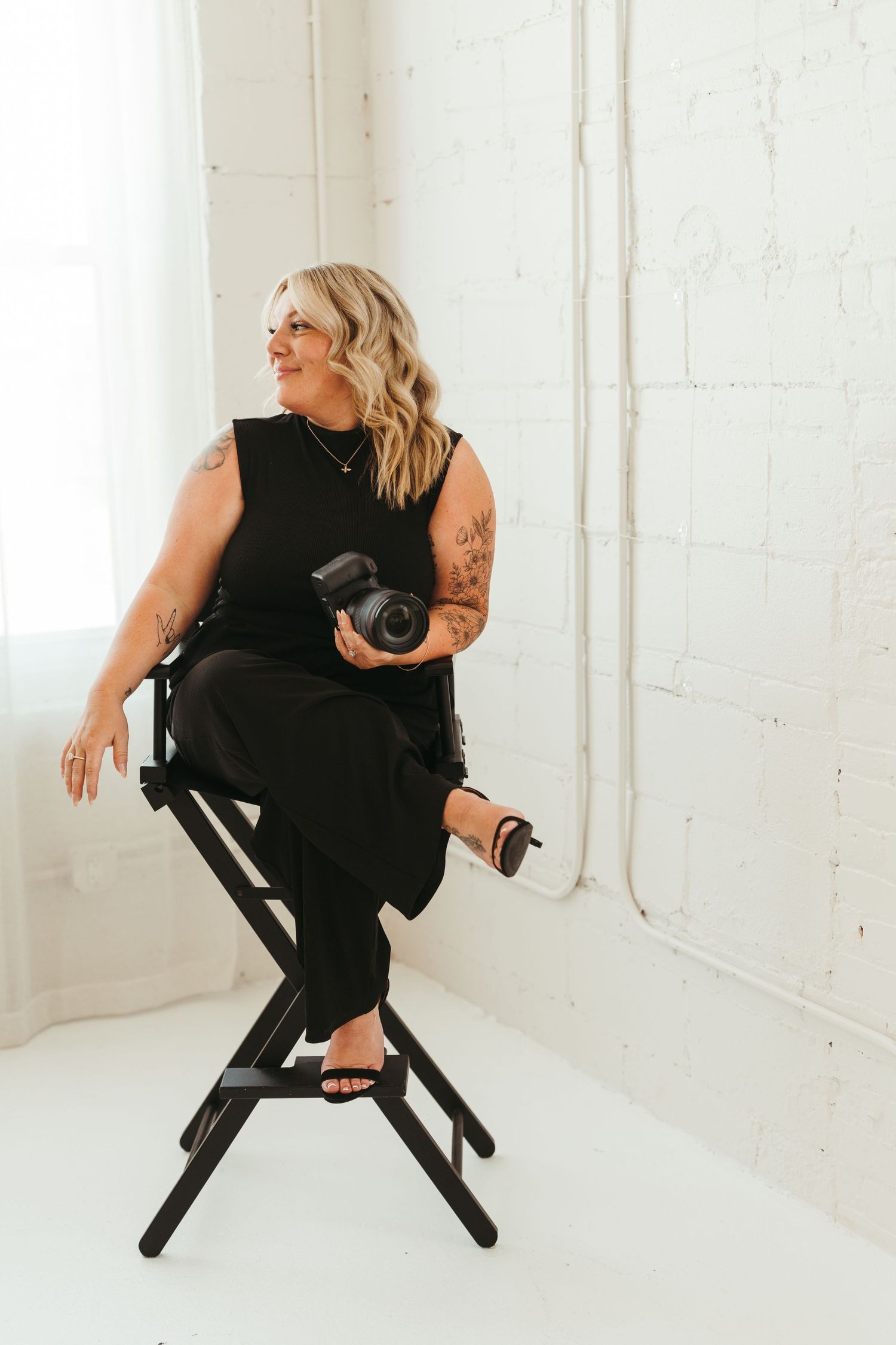 Portrait of Brandie Reamy-Johnson, a Michigan-based luxury wedding photographer known for a calm, intentional approach.