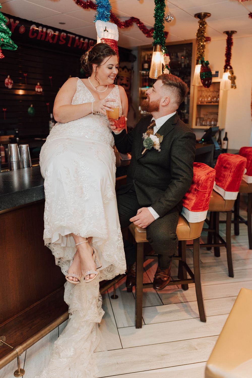 Bride and groom portrait at bar of Yorktowne Hotel  wedding in York PA– elegant winter wedding