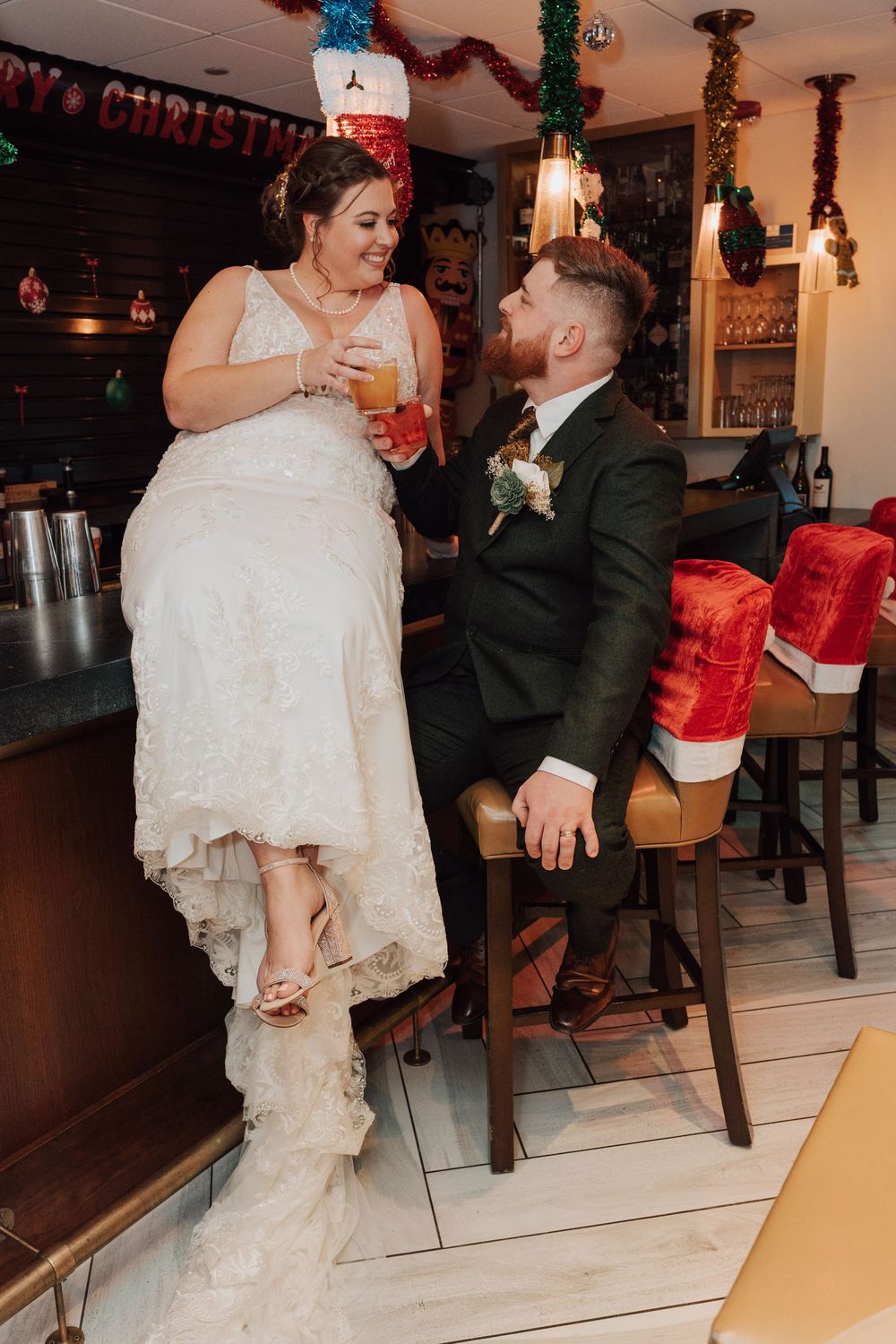 Bride and groom portrait at bar of Yorktowne Hotel  wedding in York PA– elegant winter wedding