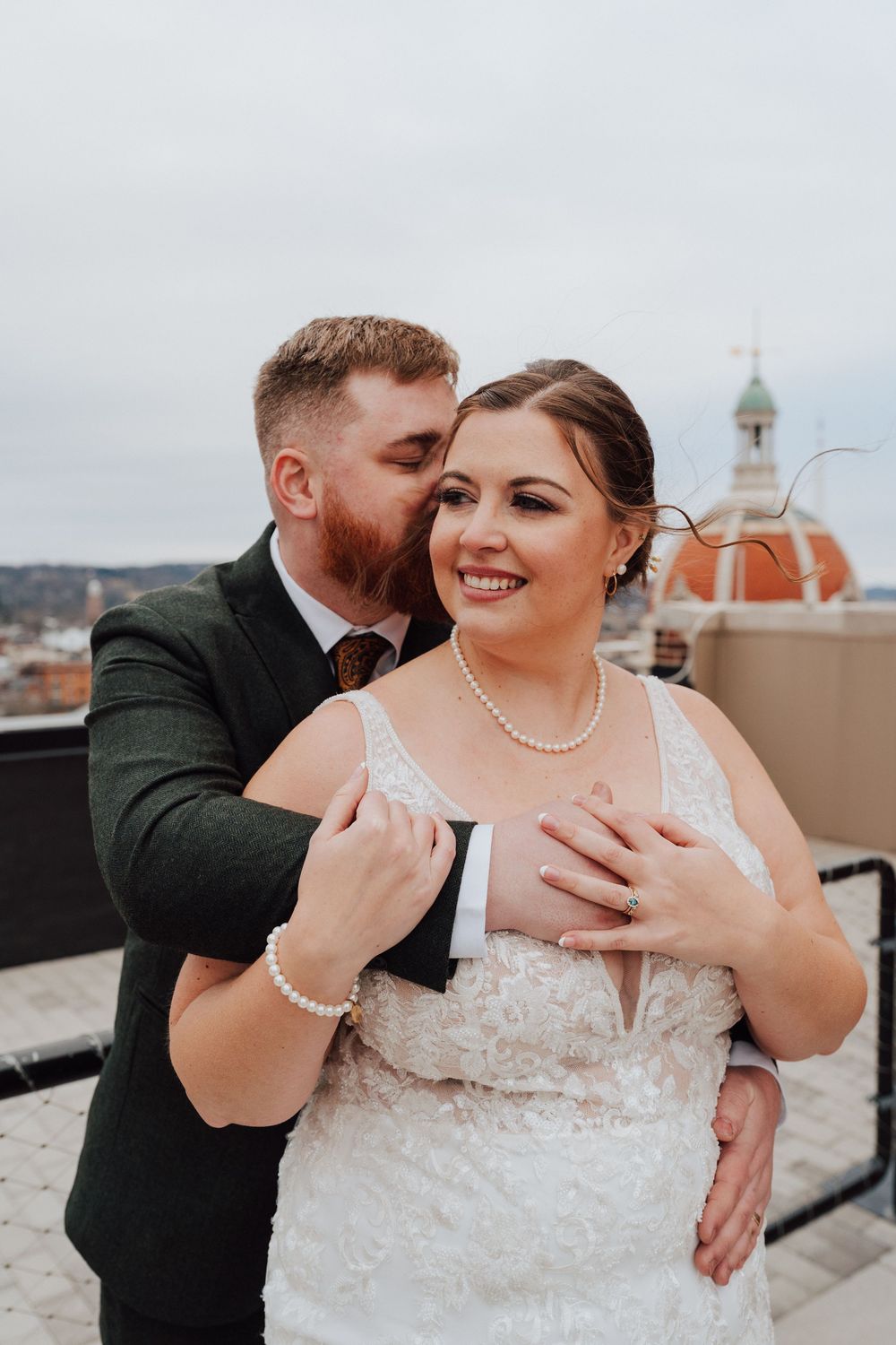 Bride and groom portrait at rooftop of the Yorktowne Hotel  wedding in York PA– elegant winter wedding