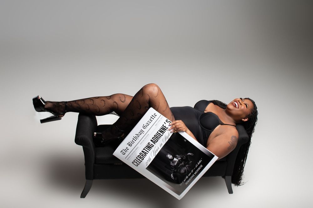 Artistic fashion photo series showing model reclining with magazine on gray backdrop.