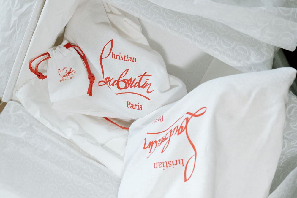 Close-up of white takeout boxes with red script text.