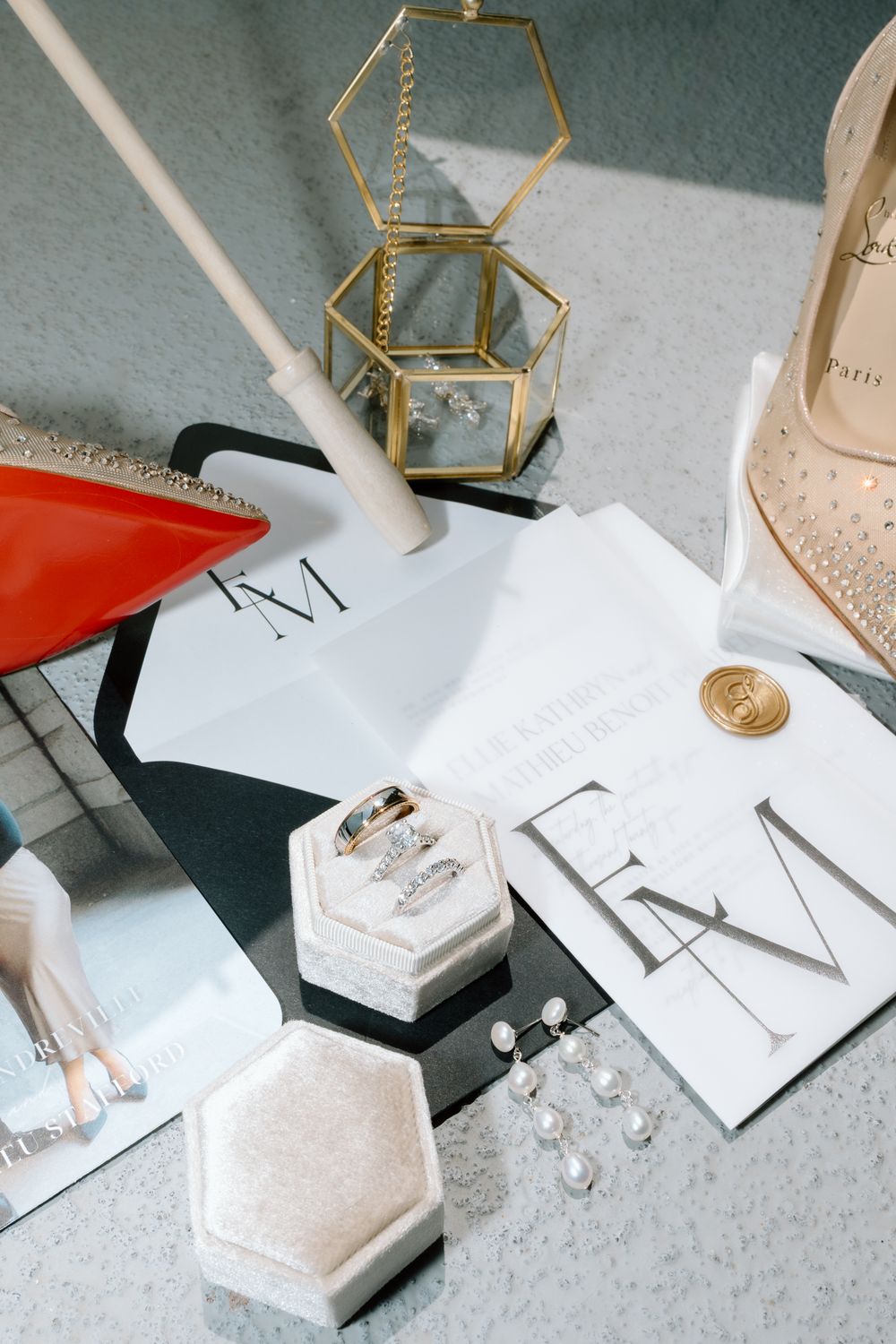 Wedding details featuring geometric decor, stationery, and accessories in neutral tones.